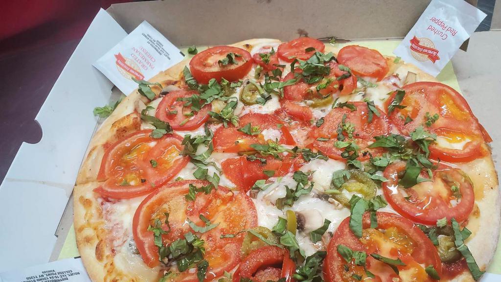 Margarita Pizza · Basil, tomato, fresh garlic and cheese.