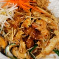 Pad Thai Talay (Seafood Pad Thai) · Rice noodle with seafood, egg, scallions, tofu, bean sprouts and crushed peanuts.