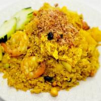 Pineapple Fried Rice · Shrimp, chicken, raisin, pineapple, onion, egg, roasted cashew nuts and a touch of curry pow...