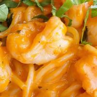 Spaghetti Alla Cognac · Chopped jumbo shrimp, shallots and basil flambeed with cognac in a light pink sauce.