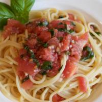 Spaghetti Alla Checca · Fresh chopped roma tomatoes, garlic, basil and extra virgin olive oil.
