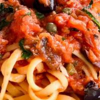 Linguini Alla Putanesca · Kalamata olives, capers, anchovies, garlic in a tomato sauce.