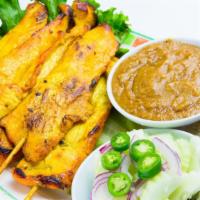 Satae · Marinated pork or chicken in mixture of Thai spices on sticks. Served with white toast, pean...