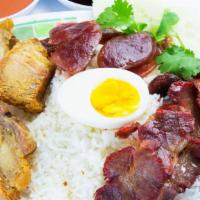 Bbq Pork Over Rice · BBQ pork, Chinese sausage, deep fried roasted pork and a half boiled egg on top of steamed r...