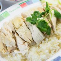 Chicken Over Rice · Special steamed rice topped with chicken, served with homemade sauce.