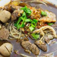 Spicy Beef Noodles Soup · Hot and spicy noodles soup with beef, beef balls, stew beef, tendon and bean sprouts.