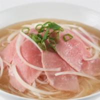 Beef Pho · Thin rare steak, onions, green onions, rice stick noodles in beef broth.