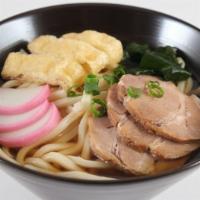 Udon · Japanese fishcake, inari tofu, pork slices, seaweed, green onions, udon noodles.