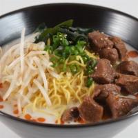 Spicy Beef Stew Ramen · Beef stew, seaweed, bean sprouts, green onions, spicy tonkostu broth, sesame seeds, and rame...