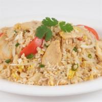 Thai Fried Rice · Fried rice with eggs, tomatoes, onions, and green onions. Served with chicken or pork.