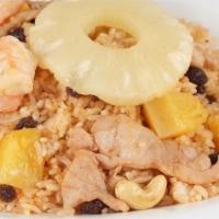 Pineapple Fried Rice · Fried rice with chicken and shrimp, cashews, raisins and pineapple chunks.