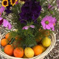 Flower Bouquet And Citrus Gift Basket · Seasonal Flower Bouquet in glass vase and basket full of fresh picked oranges, lemons, and b...