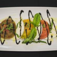 Caprese  · Heirloom tomatoes, fresh mozzarella cheese, basil, olive oil, balsamic.