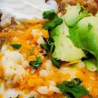 Huevos Rancheros · Corn Tortilla, Eggs, Beans & Ranchero Sauce on top.
