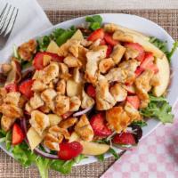 Grilled Chicken Fruit Salad · Mixed Green Lettuce, Apples, Strawberries, Glazed Walnuts, Onions & Parmesan Cheese.