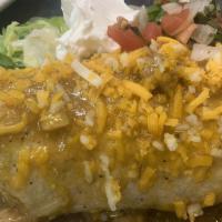 Chile Verde Burrito · Homemade chile verde on a flour tortilla stuffed with rice, beans, and cheese.