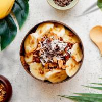 Coco Cacao Bowl · Acai bowl topped with granola, cacao nibs, agave, bananas, and shredded coconut.