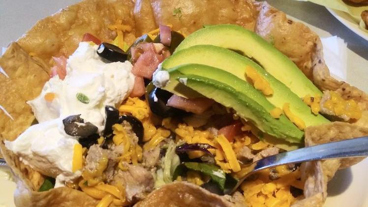 Taco Salad · Includes tortilla shell, lettuce, chop tomato, olives, guacamole, jalapeÃ±os, avocado slices, and sour cream.