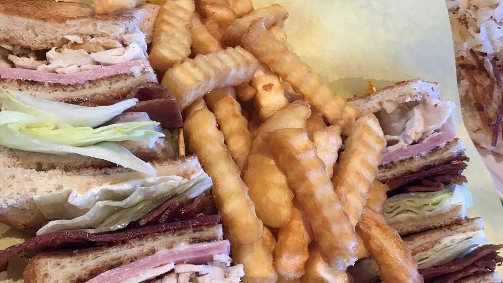 Club Sandwich · on white toast with mayo, lettuce and tomato, with turkey, ham and bacon