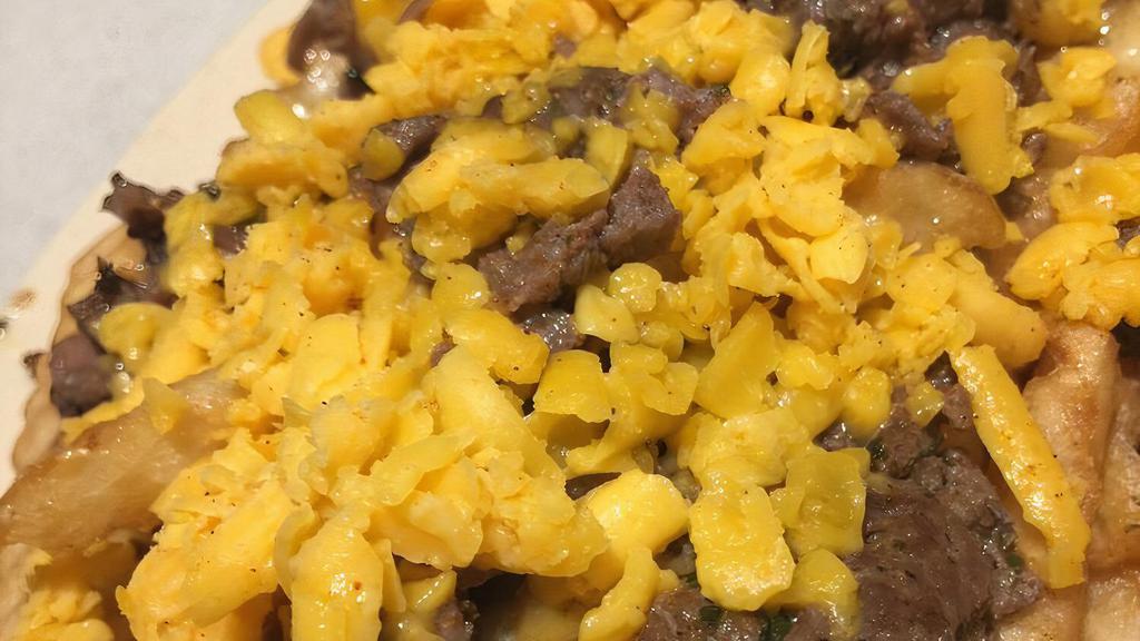 Small Carne Asada Fries  · small 
french fries topped with carne asada and cheddar cheese ( onions optional)