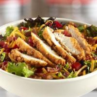 Crispy Chicken Club Salad · A crispy take on the salad style club featuring lightly breaded chicken tenders on a bed of ...