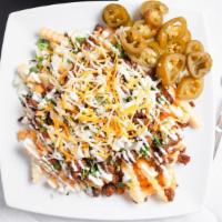Naco Fries · French Fries, your choice of meat, nacho cheese, sour cream, shredded Mexican cheese.