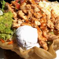 Grande Taco Salad · A flaky flour tortilla shell filled with lettuce, beans and your choice of shredded chicken ...
