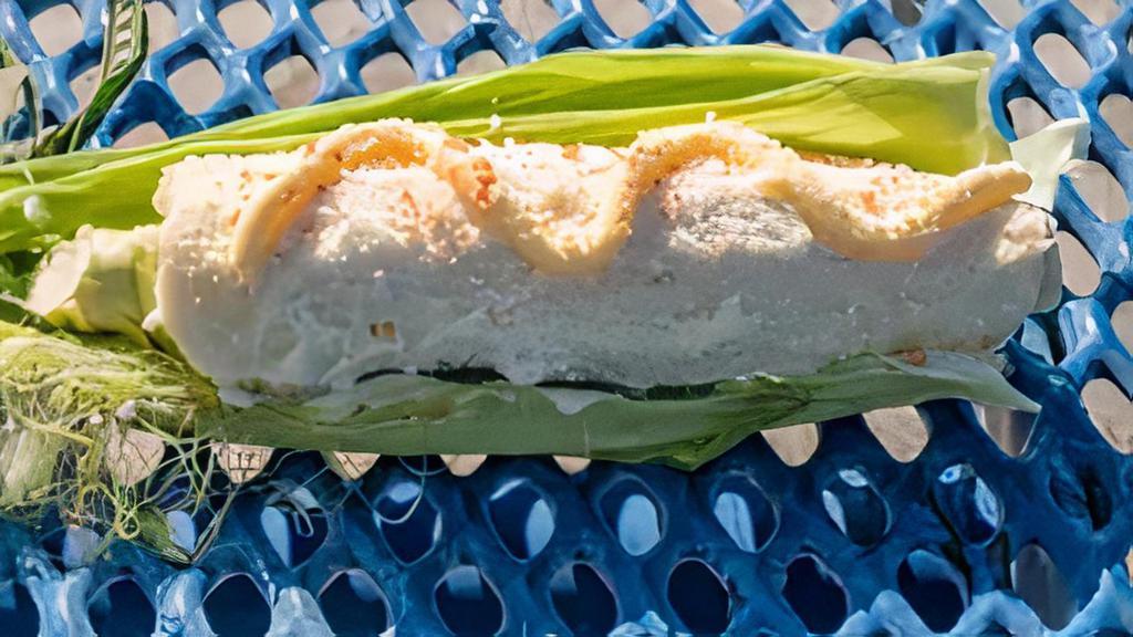 Elote · Corn on cob with mayo cheese butter and chili powder if requested.
