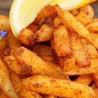 Crab Fat Fries · Tossed in old bay seasoning, Thai crab paste, and fish sauce to blend, searved with lemon & ...