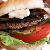 Sloane'S Single Cheeseburger · seasoned crust 1/4lb grilled premium chuck burger,  house spread, grilled onions, white amer...
