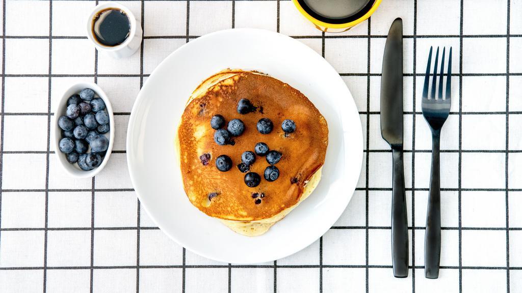 Labs Blueberry Pancakes · Three fluffy pancakes with blueberries served with a side of butter and syrup. Stack.It.Up.