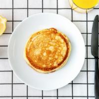 Labc Pancakes · Three fluffy pancakes served with a side of butter and syrup. Morning sunshine.