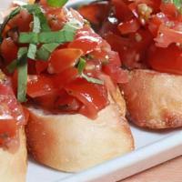 Bruschetta · Grilled baguette bread topped with chopped tomato, fresh garlic, Evoo, and fresh basil.