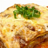 Homemade Lasagna Bolognese · Homemade lasagna sheet, bolognese sauce, mozzarella, besciamella, and parmesan.