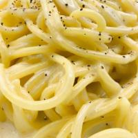 Spaghetti Cacio E Pepe · Homemade spaghetti, pecorino Romano, Parmesan cheese, touch of cream, and black pepper.