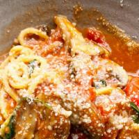 Spaghetti Primavera · Homemade spaghetti, vegetables, basil tomato sauce, and parmesan cheese.