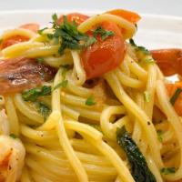 Spaghetti Con Scampi · Homemade spaghetti, garlic spicy white wine sauce, cherry tomatoes, black tiger shrimp, and ...