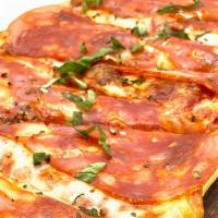 Schiacciata Pizza · Flatbread, tomato sauce, mozzarella, imported Italian spicy salame, and fresh basil.