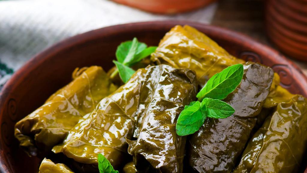 Vegan Dolma Grape Leaves  · Rice, Parsley, Tomato, and Olive Oil.