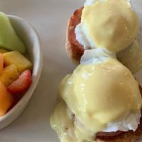 Eggs Benedict · An English muffin, poached eggs, Canadian bacon, sliced tomato, and creamy hollandaise sauce...