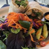 Chipotle Chicken Wrap · Smoked chicken with chipotle sauce, lettuce, tomato, jack-cheddar cheese in a cilantro lahvo...