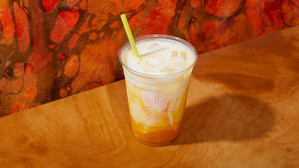 Mango Lassi · A yogurt based drink, topped with fresh mango puree.