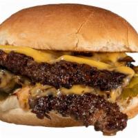 Double Smashburger · American cheese, grilled onions, pickles, magic sauce.