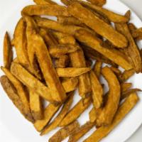 Potato Logs / Wedges · Freshly cut Russet potatoes, breaded and deep fried.