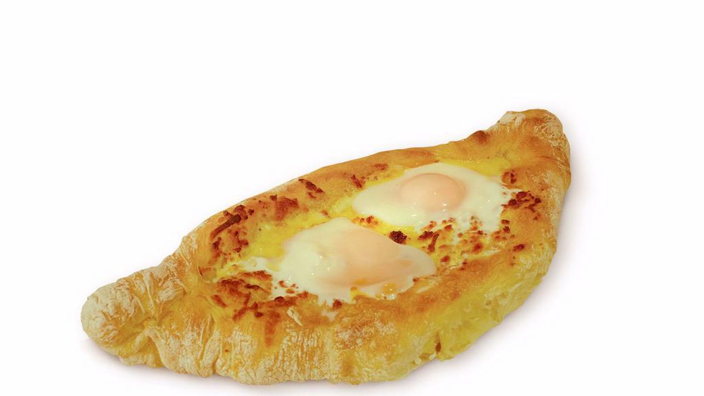 Egg Ajarski · Favorite. Two eggs, butter, mozzarella cheese, and feta cheese.