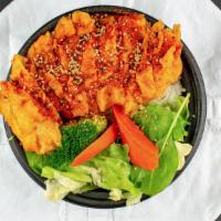 Spicy Crispy Teriyaki Chicken · Breaded white meat chicken, served over steamed white rice and side salad topped with brocco...