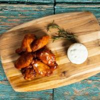See Sweet Chili Play · Our famous wings fried until perfectly golden. Tossed in sweet chili sauce, served with your...