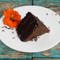 Chocolate Supreme Cake · A slice of moist chocolate cake layered with chocolate frosting.