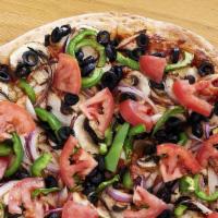 Veggie Combo Pizza · White sauce, mushrooms, bell peppers, red onions, yellow onions, olives, artichokes, tomato.