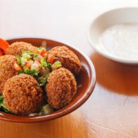 Falafel · Ground garbanzo and fava beans seasoned and deep fried.